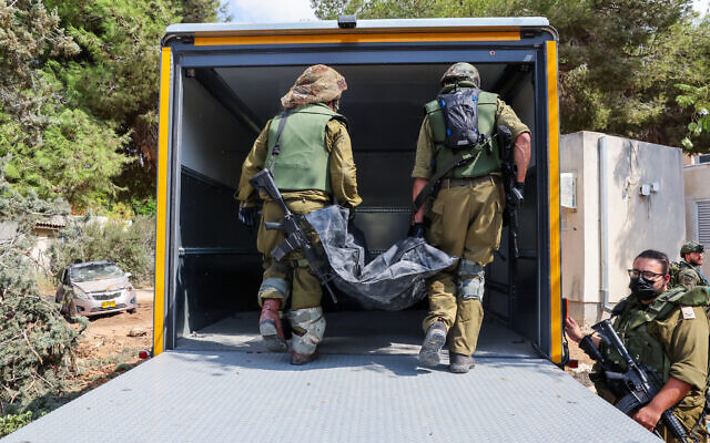 Corpses and kids’ bikes, burned homes and death in kibbutz where Hamas butchered 100